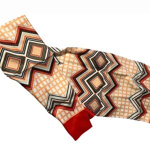 Geometric Patterned Scarf with Red Accents